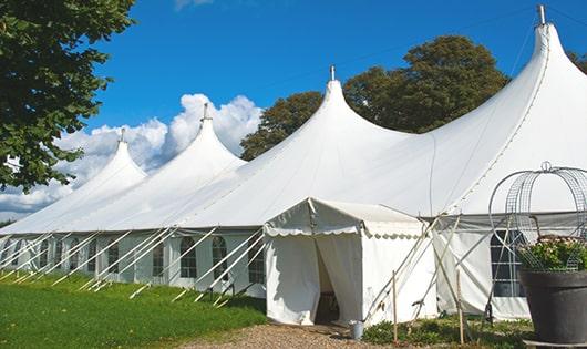 a line of sleek and modern portable restrooms ready for use at an upscale corporate event in Reinbeck